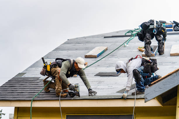Professional Gutter Installation technician working in Tewksbury, MA